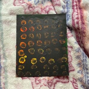 Vibrant Dot Art on Black Canvas